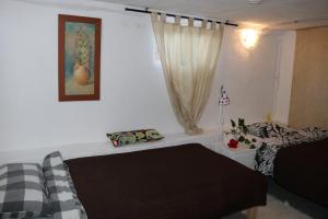 A bed or beds in a room at Half wooden rural apartment