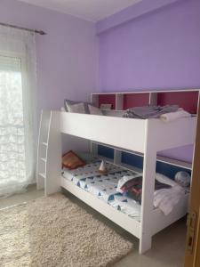 Ένα ή περισσότερα κρεβάτια σε δωμάτιο στο Appartement sable d’or