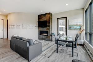 a living room with a couch and a table at New Ski In Out Luxury Loft #201 With Hot Tub, Gym & Great Views - 500 Dollars Of FREE Activities & Equipment Rentals Daily in Winter Park