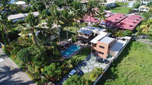an aerial view of a house with a swimming pool at Luxury in Wailoaloa in Nadi