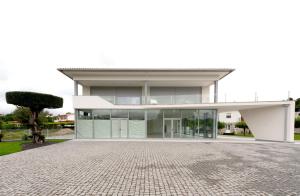a large white house with a lot of windows at Sun House - Alojamento Local - Ponte de Lima in Ponte de Lima