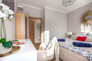 a bedroom with a bed and a dining room at SMARAGD-Emerald in Veszprém