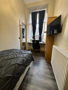 Μια τηλεόραση ή/και κέντρο ψυχαγωγίας στο Thistle City Inn