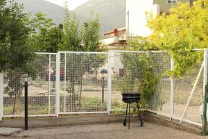 a wire fence with a chicken in a cage at Il giardino di Mondello in Mondello +2 photos