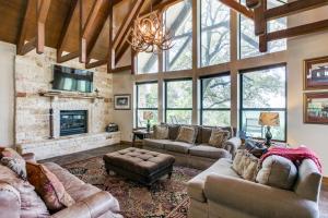 a large living room with couches and a fireplace at Sunset Retreat in Whitney