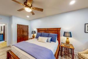 a bedroom with a bed and a ceiling fan at Abruzzi - Villa A in Eatonton 