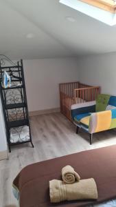 a room with a crib and a bed and a bunk bed at Holiday Home Funchal Center in Funchal