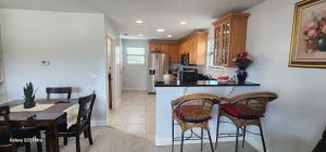 a kitchen and dining room with a table and chairs at Apartment in Ponte Vedra Beach in Ponte Vedra Beach