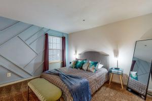 a bedroom with a bed and a window at The Garrison Getaway in Fruitland