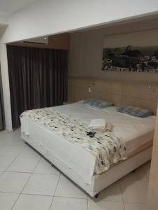 Postel nebo postele na pokoji v ubytování Quality Barra Jacarepaguá