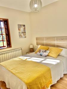 Łóżko lub łóżka w pokoju w obiekcie Casa las Hiedras