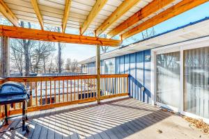 a large wooden deck with a wooden roof at The Jewel of Elkhart, Upper Unit in Elkhart