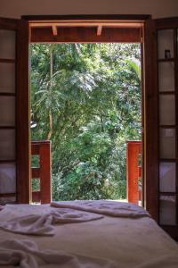 Cama ou camas em um quarto em Pousada Riacho da Serra