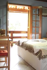 Cama ou camas em um quarto em Pousada Riacho da Serra