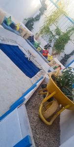 a yellow chair sitting next to a swimming pool at شاليهات ليله الدرب in Qarār