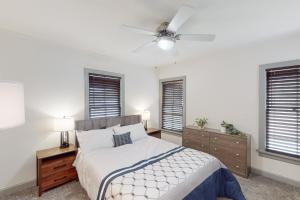 a bedroom with a bed and a ceiling fan at The Modern Farmhouse Cottage in Wichita Falls