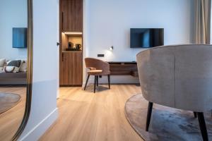 Un televizor și/sau centru de divertisment la ONE TWO FOUR - Hotel & Spa