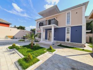 a house with a blue and white facade at Rest Paradise Villa Gabala in Gabala +23 photos