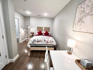 a bedroom with a bed with red pillows on it at 307 Kyoto style 1BDR Apt in center city in Philadelphia