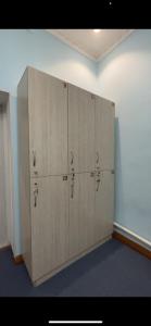 a large locker room with four lockers in a room at LOONA FAMILY HOSTEL in Tashkent