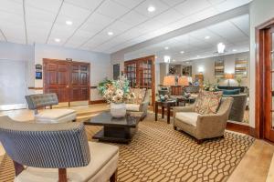 a lobby with couches and chairs and a table at Best Western Plus Bridgeport Inn in Bridgeport