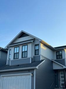 a house with a garage at 2 Bedroom 2 Washrooms Brand New Beautiful & Cozy Suite in Calgary