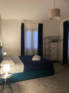 Postel nebo postele na pokoji v ubytování Dimora 7 fontane + 24 fotografií