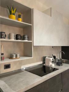 a kitchen with a sink and a counter at Dimora 7 fontane in Paola +24 photos