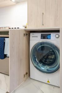a washer and dryer sitting in a kitchen at 3 bedroom 2 bath Central City in Christchurch