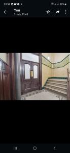 a picture of a room with stairs and a door at Princess Street Apartment in Manchester
