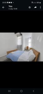 Llit o llits en una habitació de Princess Street Apartment