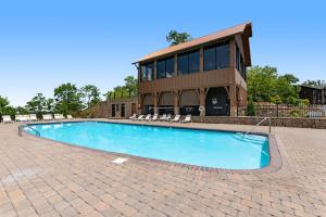 a swimming pool in front of a building at Soaring High in Pigeon Forge