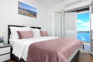 Panoramic apartment Malis tesisinde bir odada yatak veya yataklar