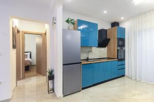 Panoramic apartment Malis tesisinde mutfak veya mini mutfak