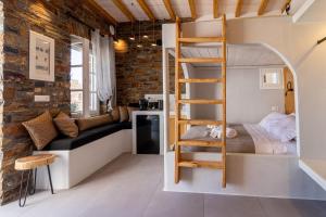 a small room with a bunk bed and a ladder at KL , Cozy Suite II in Kithnos