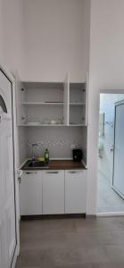 A cozinha ou cozinha compacta de Apartmani Vila Milaris