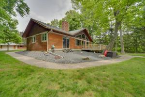 a house with a large yard in front of it at Hayward Cabin on Lac Courte Oreilles! in Hayward