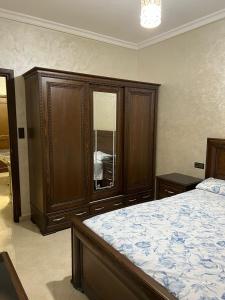 a bedroom with a large bed and a window at Appartement boulaàyoun de luxe à louer nador 2 in Nador