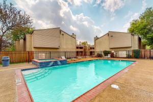 a large swimming pool in front of a house at Harvey House in College Station