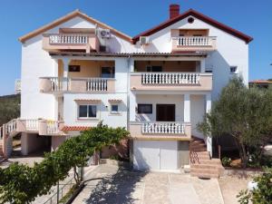 a villa with a view of the house at Apartment Kukljica 8237c in Kukljica