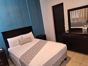 Postel nebo postele na pokoji v ubytování Hotel Costa Verde