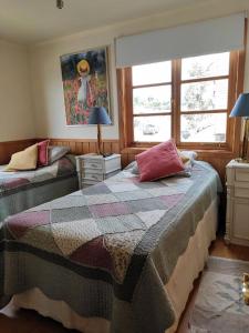 Postel nebo postele na pokoji v ubytování Casa Mia, Puerto Varas, habitación doble + 12 fotografií