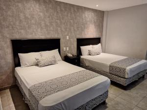 Postel nebo postele na pokoji v ubytování Hotel Costa Verde