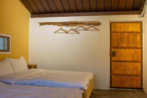 Llit o llits en una habitació de 彎腰拾光旅人空間Good Old Times