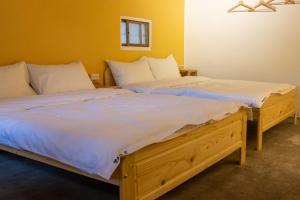 Llit o llits en una habitació de 彎腰拾光旅人空間Good Old Times