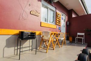 Posezení v ubytování La Casita Bem Gaúcha com garagem