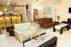 a living room with a couch and a table at Villa in the sea Crete in Stavros