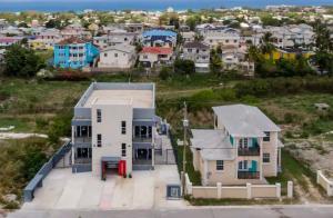 an aerial view of a house in a city at The Rise South Coast Rental by On Point Property Management in Christ Church