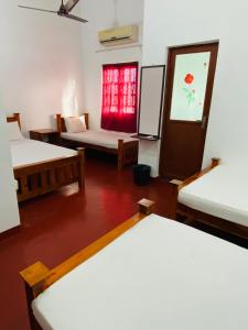 Postel nebo postele na pokoji v ubytování Athena Guest House