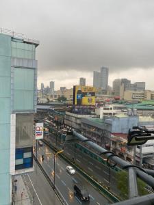 a view of a city with a train on a street at Sun Star Grand Hotel in Manila